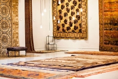 An assemblage of swoonworthy rugs from around the world is displayed, gallery-style, in New York&rsquo;s ABC Carpet & Home.
