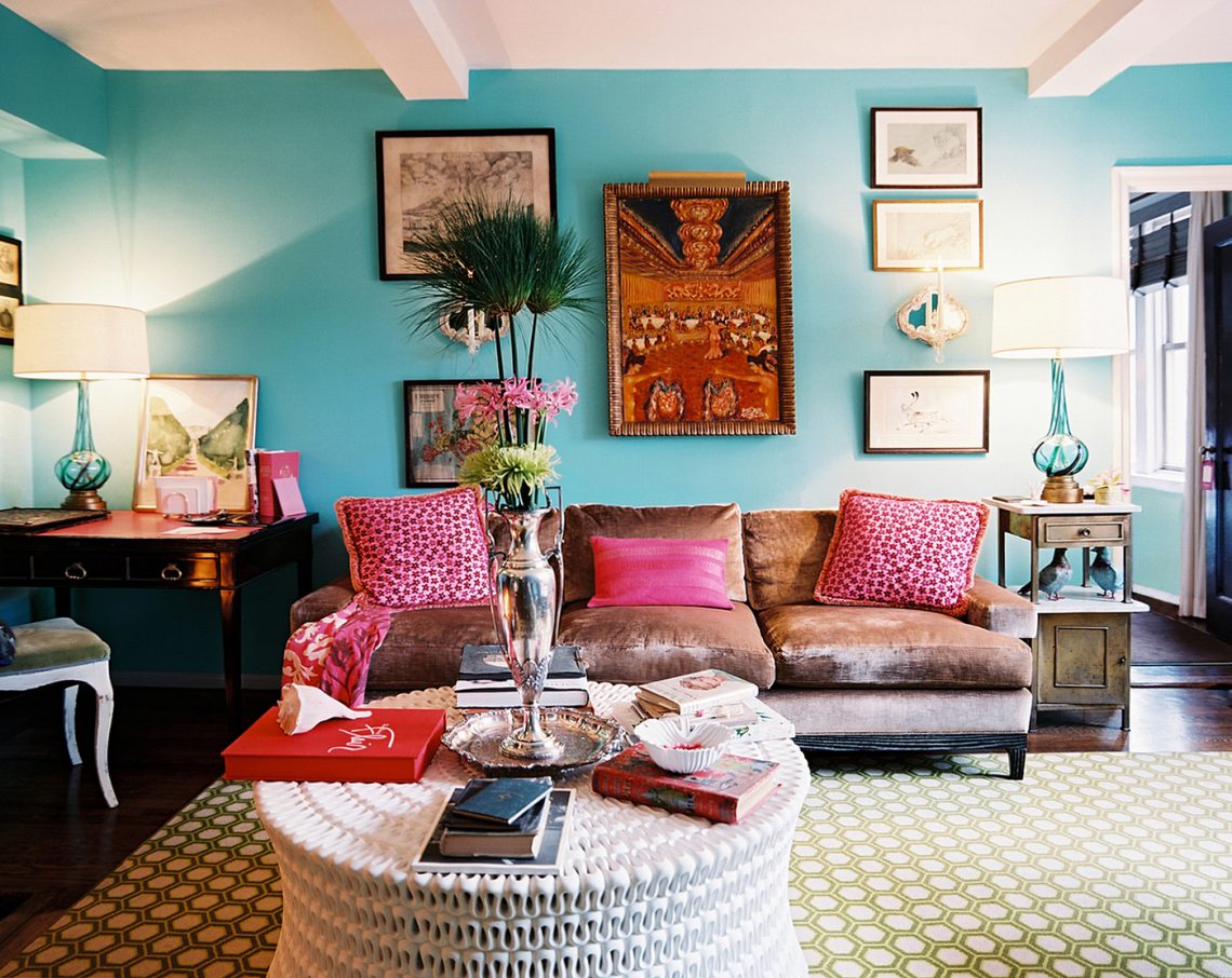 boho-chic-bohemian-style-living-room-blue-wall-color-ethnic-abstract-painting-honeycomb-carpet-pattern-white-table-hardwood-fur-sofa-table-single-chair