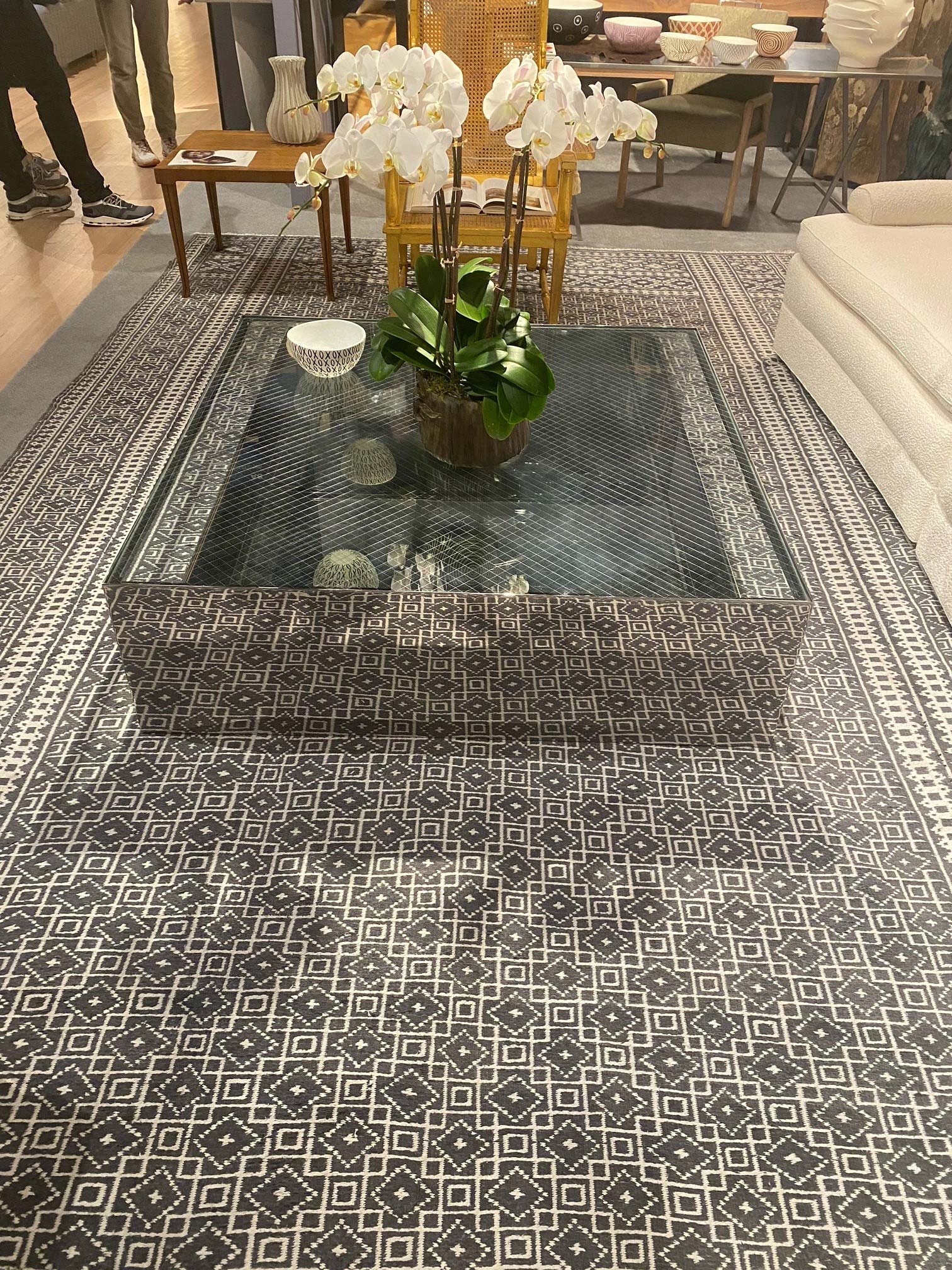 A vintage rug from the Doris Leslie Blau collection surrounded by modern pieces from Liz O’Brien Gallery