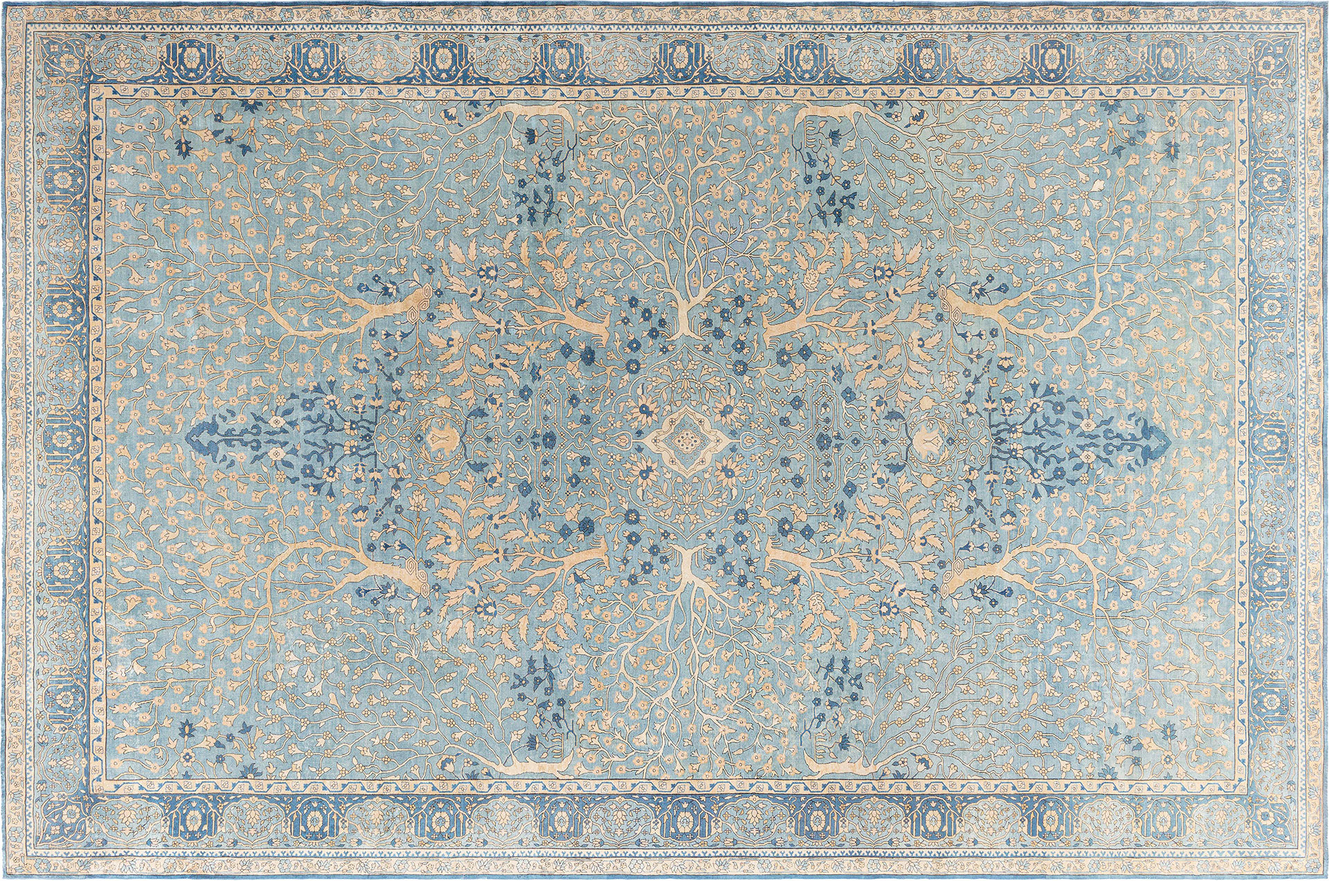 An Indian Garden Rug alternating shades of aqua blue, cerulean, and ultramarine