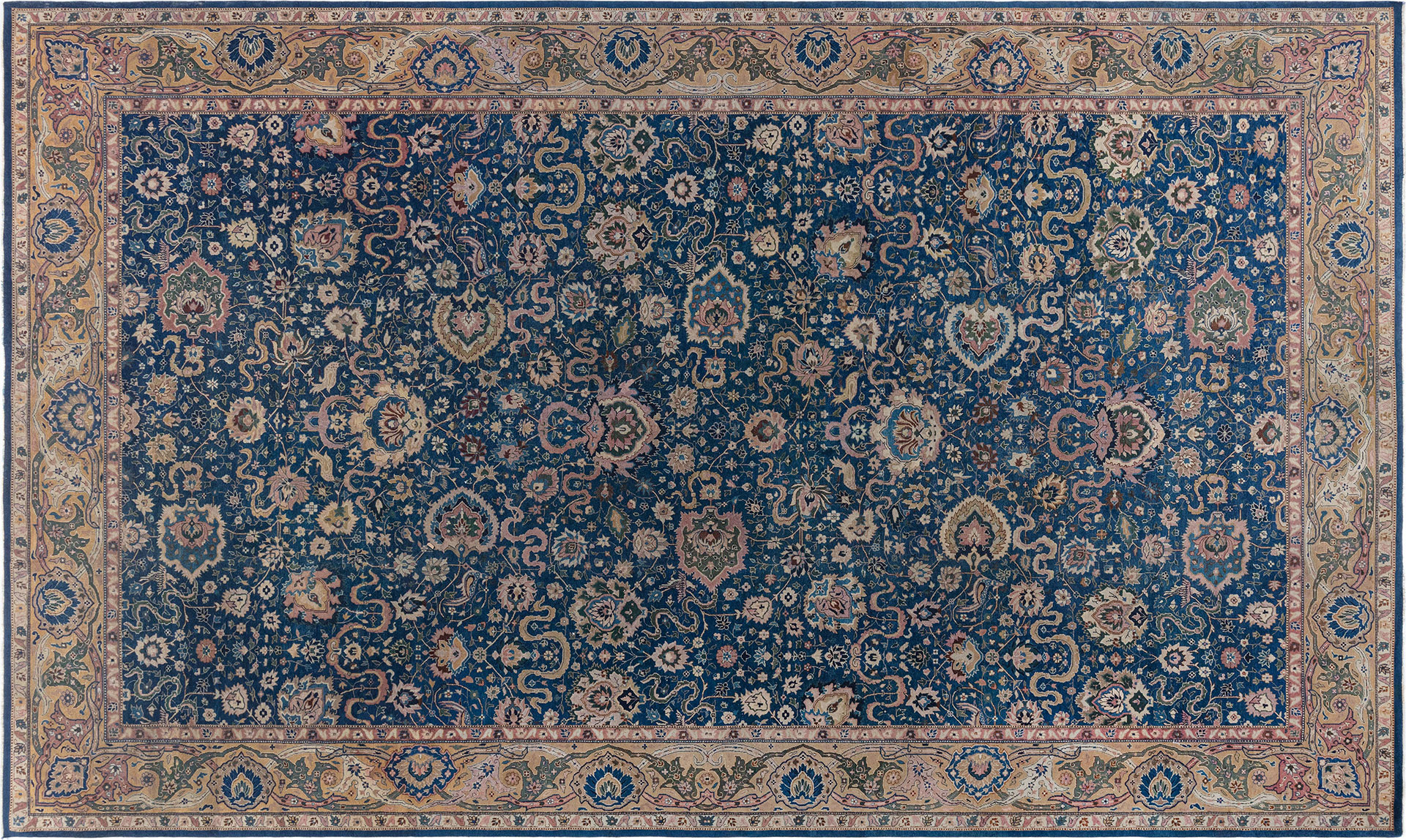 A statement antique Indian rug with an ample field of deep sapphire-blue